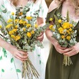 Model Holding Eucalyptus and Yellow Dried Flower Wedding Bouquet Close-up