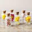 Set of 6 Summer Meadow Dried Flower Mini Wedding Favour Bottles on Table