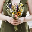 Model Holding Summer Meadow Dried Flower Bridesmaid Bouquet