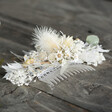 Vintage White Dried Flower Hair Comb on Wood Surface