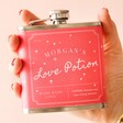 Model Holding Personalised Love Potion Hip Flask