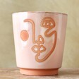 Front of Large Pink and Terracotta Abstract Face Planter, H19cm