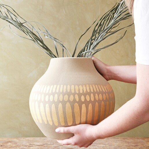 model carrying Large Round Hand-Painted Vase in Grey