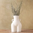 Front of Large White Bum Vase with Handles Filled with Dried Grass