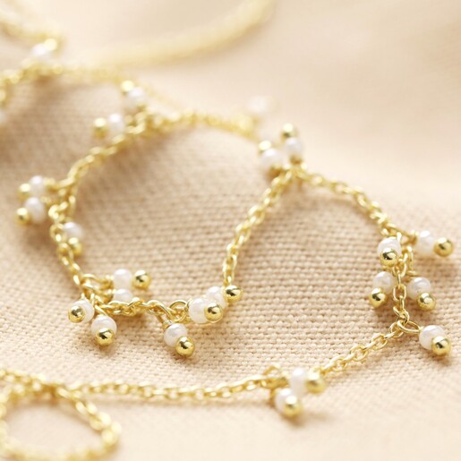 Close Up of Chain and Pearl Cluster Necklace in Gold