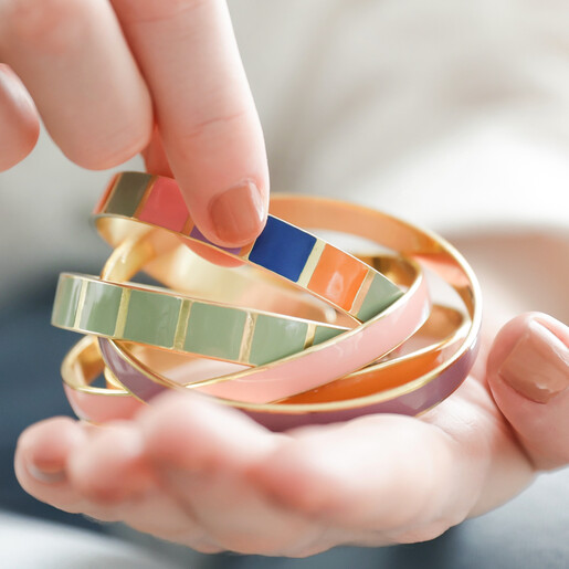Model Holding Colourful Enamel Bangles