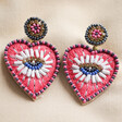 Pink Heart Eye Bead Earrings on Fabric