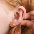 Small Orange Enamel Smiley Face Stud Earrings in Gold Worn by Model
