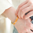 Rust Orange Enamel Slim Bangle in Gold on Model