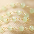 Close-up of Sage Green Facet Beads on Gold Necklace