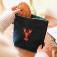 Model Using Velvet Beaded Lobster Make Up Bag in Teal