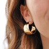 Wide Hammered Hoop Earrings in Gold on Model