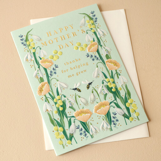 Thanks for Helping me Grow Mother's Day Card With Cream Envelope on Neutral Background