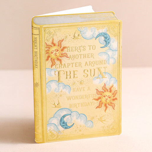 Vintage Novel Around the Sun Birthday Card  Vintage Novel Around the Sun Birthday Card Stood on Pink Surface