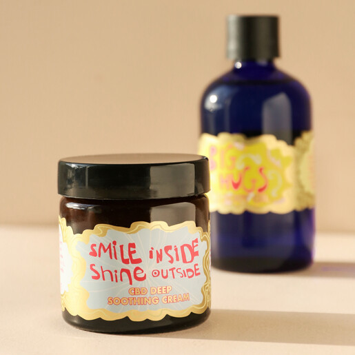 ARTHOUSE Unlimited CBD Smile Inside Soothing Cream Out of Packaging with Body Oil in Background