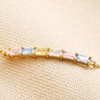 Close Up of Pendant on Pastel Baguette Crystal Bar Bracelet in Gold