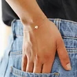 Model Wearing Pearl Heart Charm Bracelet in Gold