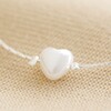 Close Up of Heart Charm on Pearl Heart Charm Bracelet in Silver