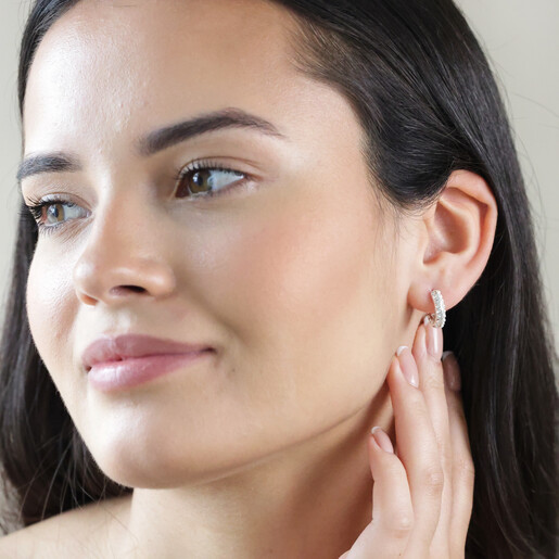 Hoops on Model Model Wearing Crystal and Pearl Huggie Hoop Earrings in Silver with Hand Under Ear
