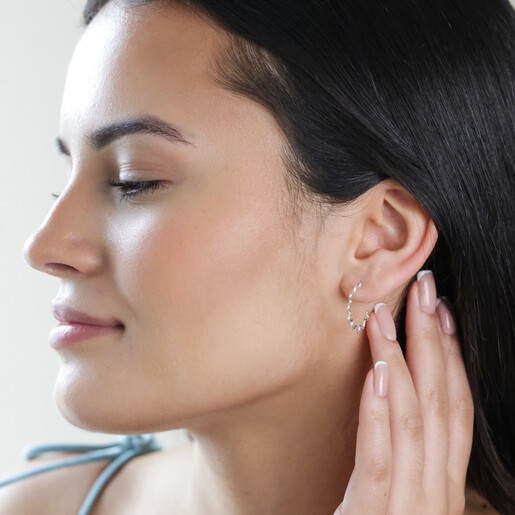 Model Wearing Wavy Lines Hoop Earrings in Silver