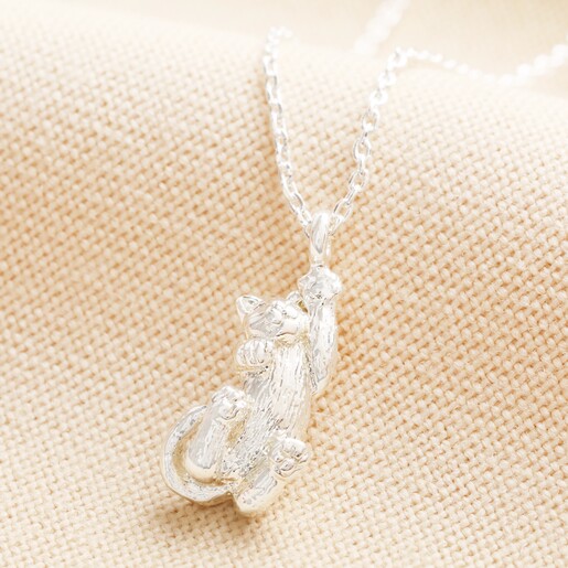 Close up of pendant on Cat Pendant Necklace in Silver on neutral coloured material