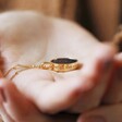 Celestial Semi-Precious Stone Pendant Necklace in Gold Held by Model