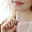 Model Wearing Celestial Semi-Precious Stone Pendant Necklace in Silver and Holding Pendant