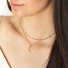 Colourful Crystal Crescent Moon Hammered Pendant Necklace in Gold on model in curated look