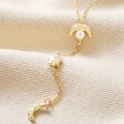 Close Up of Drop Pendant on Crystal Crescent Moon Lariat Necklace in Gold