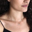 Model looking down wearing Eternity Ring Pendant Necklace in Silver