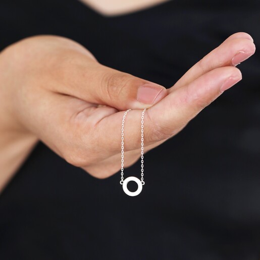 Model holding Eternity Ring Pendant Necklace in Silverin front 