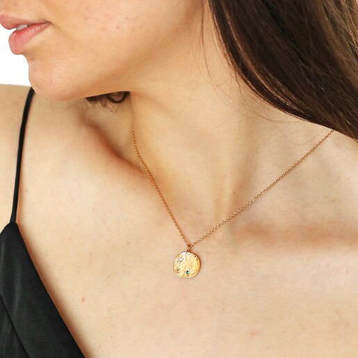 Close up of Multicoloured Crystal Daisy Disc Pendant Necklace in Gold on model