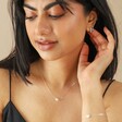 Pearl Heart Charm Necklace in Silver on Model with Hand Behind Ear