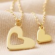 Set of 2 Friendship Heart Pendant Necklaces in Gold on Neutral Fabric
