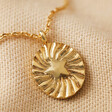 Close Up of Pendant on Stamped Star Pendant Necklace in Gold with Neutral Background