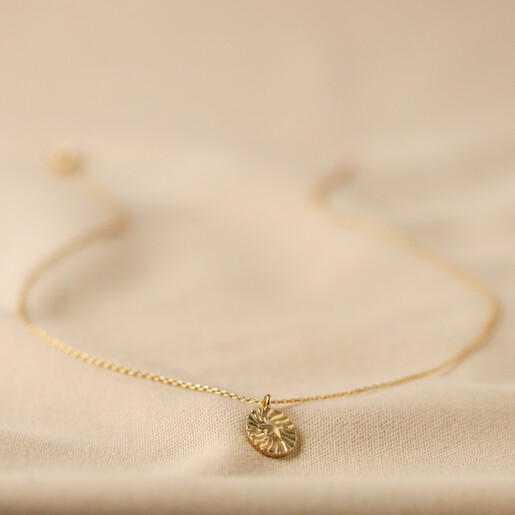 Stamped Star Pendant Necklace in Gold Stamped Star Pendant Necklace in Gold on Beige Fabric Full Length