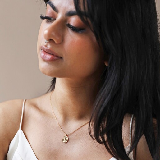 Necklace on Model Model Looking to Side Wearing Stamped Star Pendant Necklace in Gold