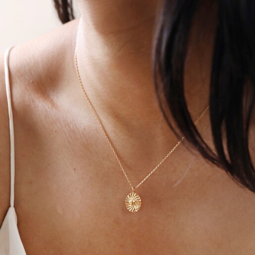 Model Wearing Necklace Close Up of Stamped Star Pendant Necklace in Gold on Model