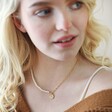 Model Wearing Talisman Charm Pearl and Chain Necklace in Gold