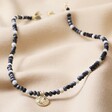 Talisman Moon Charm Beaded Necklace in Gold Full Length on Beige Coloured Fabric