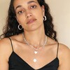 Thick Figaro Chain and Shell Heart Pendant Necklace in Silver On Model with Other Necklaces