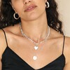 Thick Figaro Chain and Shell Heart Pendant Necklace in Silver Layered with Other Necklaces on Model
