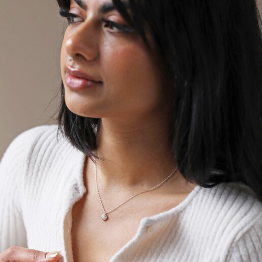 Model Wearing Tiny Molten Heart Pendant Necklace in Silver
