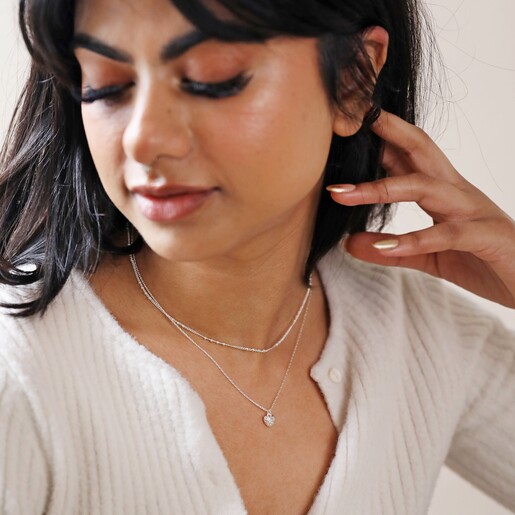 Tiny Molten Heart Pendant Necklace in Silver on Model