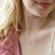 Close Up of Model Wearing Tiny Molten Heart Pendant Necklace in Silver