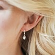 Model Wearing Opal Sun Huggie Hoop Earrings in Silver