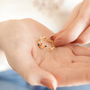 Model holding Adjustable Blue Crystal Constellation Ring in Gold in palm of hand