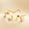 Adjustable Blue Crystal Constellation Ring in Gold on Neutral Coloured Fabric