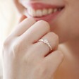Smiling Model Wearing Adjustable February Violet Birth Flower Ring in Silver