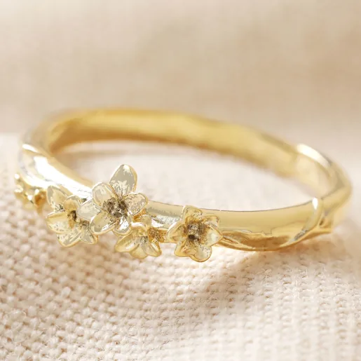 August Gladiolus Birth Flower Ring in Gold on Beige Fabric